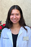 Portrait of Madison Wong standing outside wearing a white coat